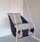 Große schwarze Babyschaukel aus Leinen, schwarz gestreift.
